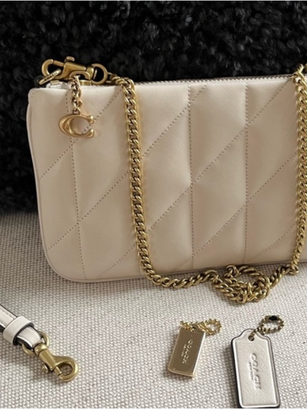 Coach Cream pouchette bag with Gold shoulder chain and leather wristband